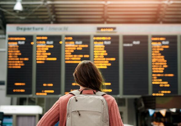 Woman, back and airport with flight schedule 