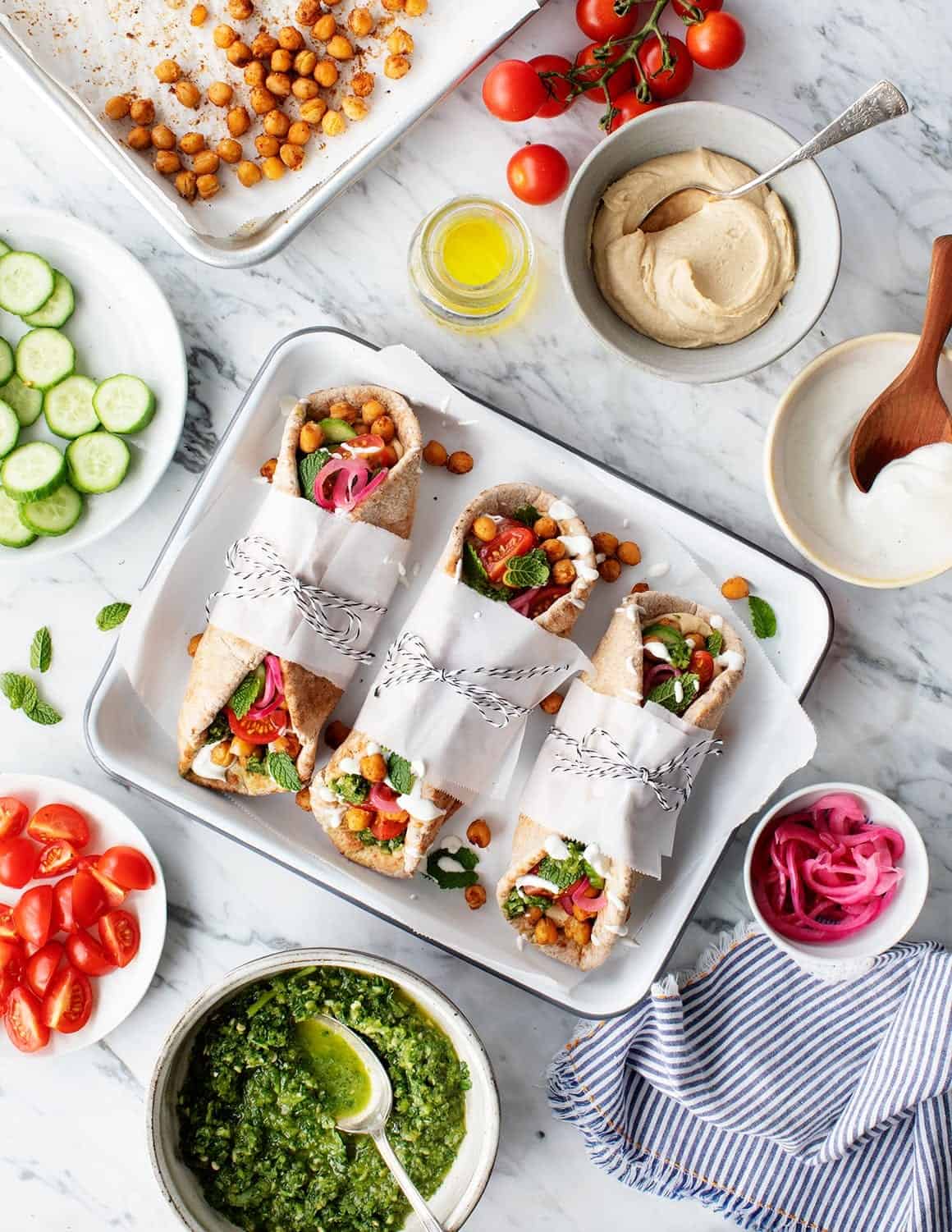 Chickpea Shawarma Wraps tied with string on a tray