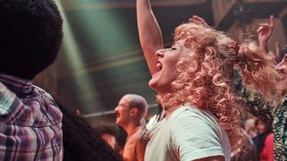 Group of people enjoying an evening out at a music venue