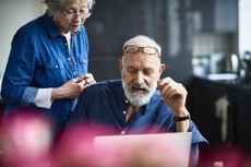 pensioners looking at laptop