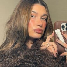 Hailey Bieber with dark chrome nails