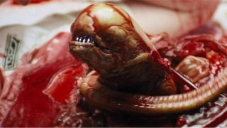 A baby Xenomorph coming out of chest during the horror movie, Alien.