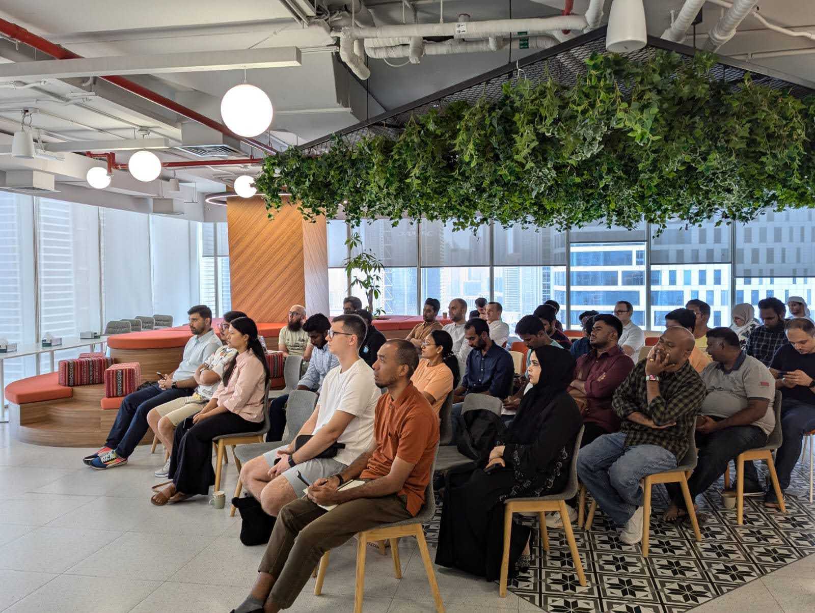 Tech enthusiasts sit in rows of chairs at the 39th AWS user group meetup.