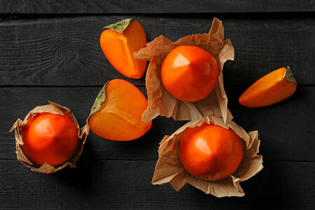 Persimmon on a black table