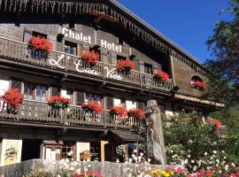 Chalet Appart'Hôtel l'Eau Vive，Saint-Nicolas-la-Chapelle的木屋