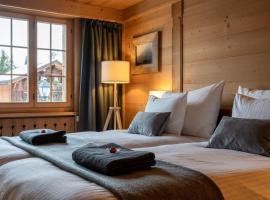 Charming Alpine Apartment Gstaad, хотел в Гстаад