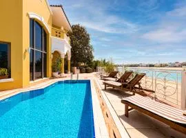 Palm Jumeirah Beachfront private pool villa 5 BR & 1 maids room with access to beach