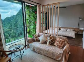 Unique Boho Style Condo with NETFLIX for up to 5PAX - Enjoy Mountain View while swimming at the Infinity Pool & Natural Hotspring Pool, 2mins walk to the Lost World of Tambun, Water Themepark at IPOH, hotel in Ipoh