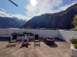 Hostel Plantas y Blanco, hôtel à Baños