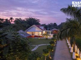 StayVista's Rupohi - Jorhat with Manicured Lawn & Gazebo, hotel di Jorhāt