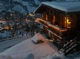 SOMPTUEUX CHALET BARON MEGEVE VUE.Jaccuzi.4 mn a pied au centre, Hotel in Megève