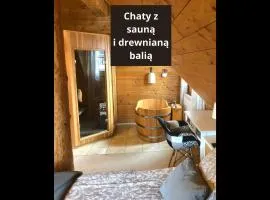 Chaty Świerkowe Wzgórze - drewniane domy z sauną i balią