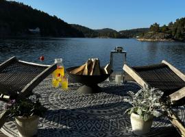 Moderne hytte i vannkanten med tilgang til brygge og båt, hotel v destinácii Risor