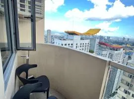 Cubao Manhattan Plaza T139G - HUGE Studio with Pool, Kitchen & Balcony, Walk Distance to Araneta Coliseum LRT MRT Malls in Cubao Quezon City - Staycations by SMS