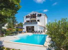 Villa Andrija Family Dream with heated pool at the sea with beautiful garden, outside cinema and kids playground