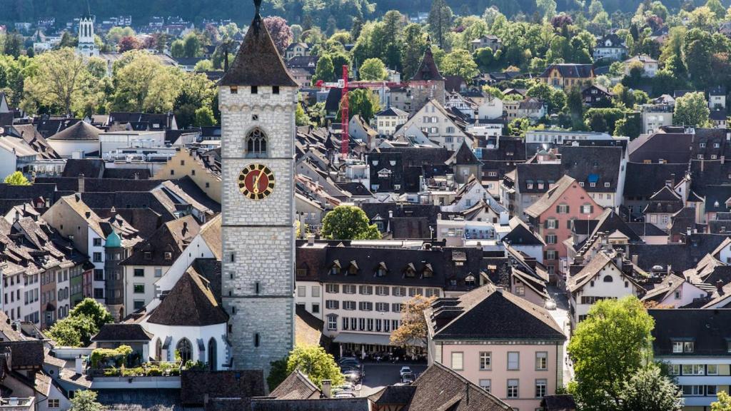 an aerial view of a town with a clock tower at Hotel Kronenhof in Schaffhausen