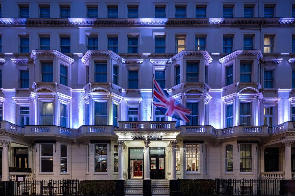 a building with the british flag in front of it at Radisson Blu Hotel, London South Kensington - formerly Vanderbilt in London