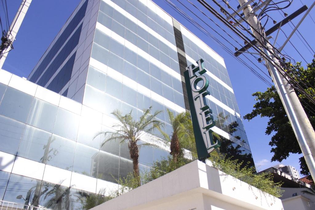 a building with a sign in front of it at Floresta Hotel in Sao Paulo