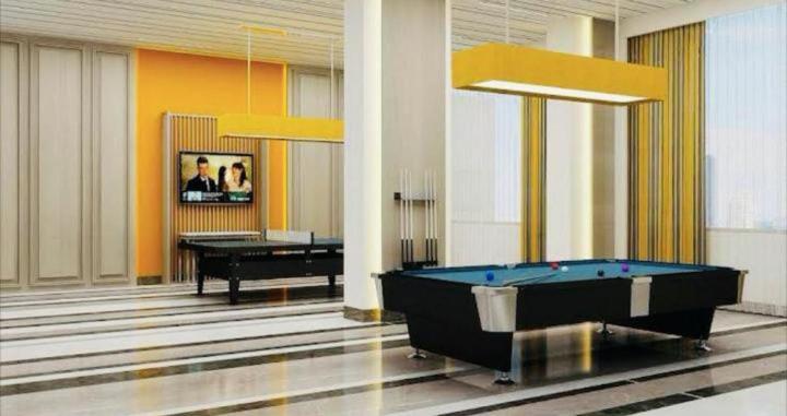 a billiard room with a pool table and a piano at DLF Stay in Lucknow