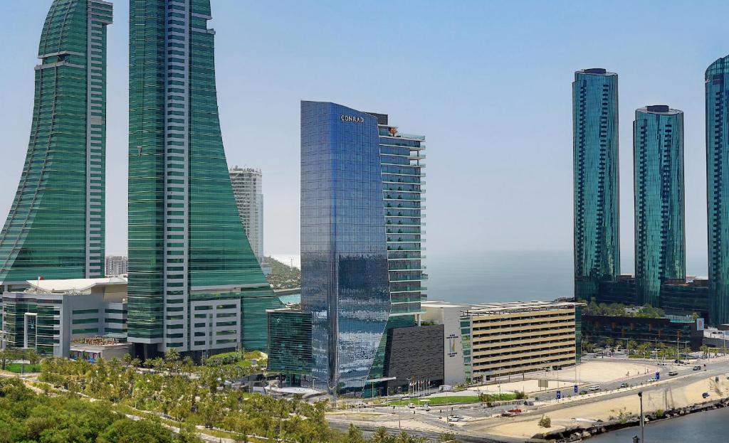 a group of tall buildings in a city at Conrad Bahrain Financial Harbour in Manama