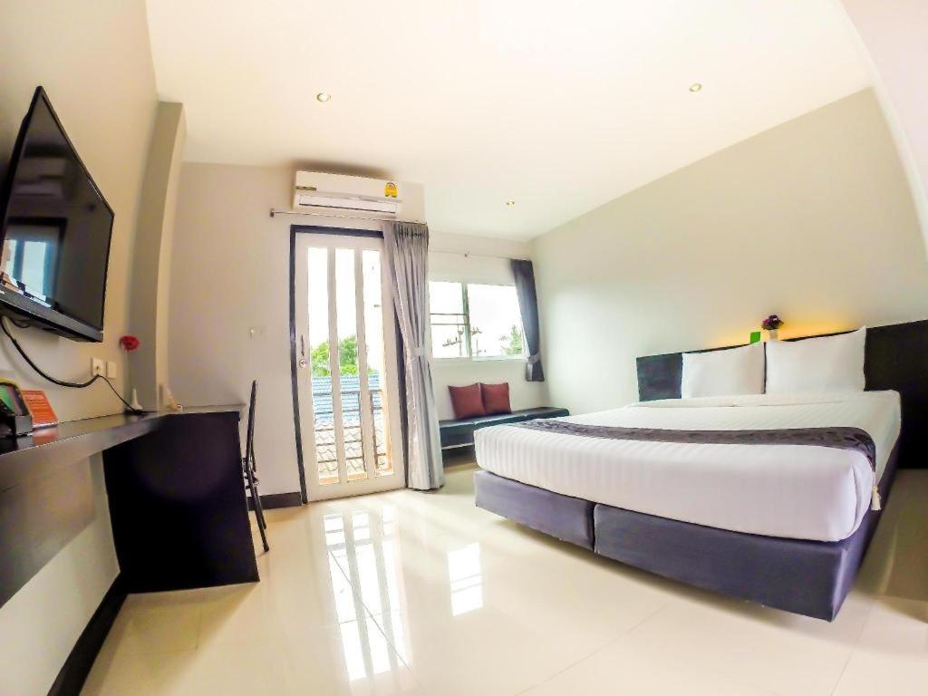 Giường trong phòng chung tại My Place Phuket Airport Mansion