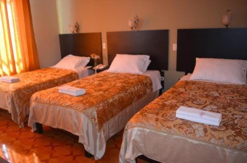 A bed or beds in a room at Hotel CASA REAL