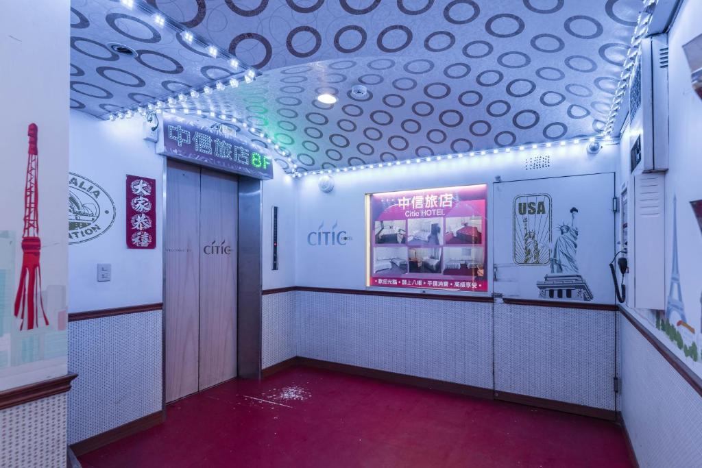 a hallway of a restaurant with a sign on the wall at Citic Hotel in Yonghe