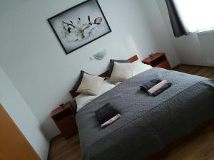 Uma cama ou camas num quarto em ANGEL´S VENDÉGHÁZ