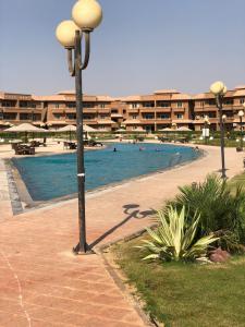 Swimming pool sa o malapit sa Relaxing Studio-Malibu El Sokhna Resort