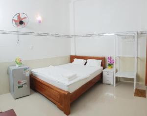 Postelja oz. postelje v sobi nastanitve Hai Phuong Tuyen Guesthouse