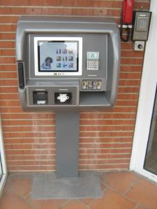 a pay phone is attached to a brick wall at Premiere Classe Toulouse Sud Labege in Labège