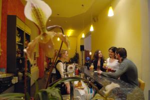 a group of people sitting at a bar at Hotel Schweizerhof in Engelberg