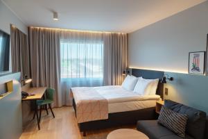 เตียงในห้องที่ Holiday Inn Helsinki - Expo, an IHG Hotel