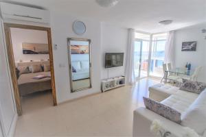 Telewizja i/lub zestaw kina domowego w obiekcie Residence Vacanza Torre Monaco