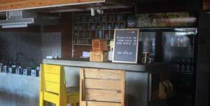 a counter in a bar in a store at Shelter Hostel Malang in Malang