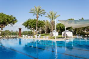 The swimming pool at or close to Dan Caesarea Resort