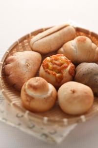 a basket filled with different types of potatoes at Minami Onna Tropical in Onna