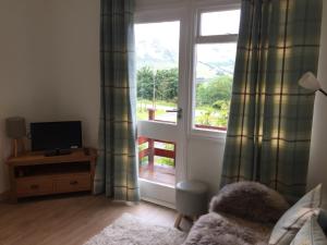 Loch Broom Cabins Seaviews& Petfriendly tesisinde bir televizyon ve/veya eğlence merkezi