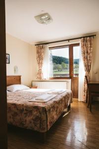 Een bed of bedden in een kamer bij Villa Maria, Complex Aleksandria