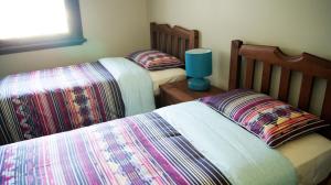 Een bed of bedden in een kamer bij Australia Hotel Fremantle