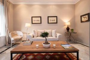 a living room with a couch and a table at BCN Apartments 41 in Barcelona