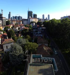 arial view of a city with a building and buildings at Hotel Zara Milano in Milan