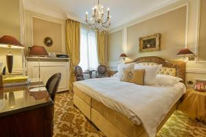 Кровать или кровати в номере Relais & Châteaux Hotel Heritage