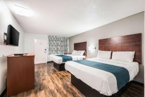 Tempat tidur dalam kamar di Motel 6-Tupelo, MS - Downtown