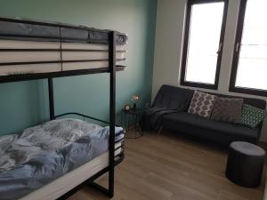 Ein Bett oder Betten in einem Zimmer der Unterkunft Vakantiewoning Ijzerfront 14-18