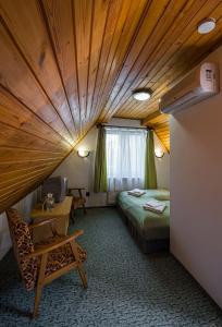 Cama ou camas em um quarto em Babi Guesthouse - Babi Vendégház