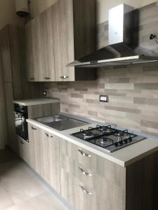 Kuchyň nebo kuchyňský kout v ubytování FORIA 58 APARTAMENTS