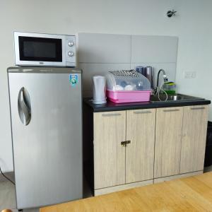 A kitchen or kitchenette at Octagon Premium Ipoh Town Center 2BR 121 by Grab A Stay