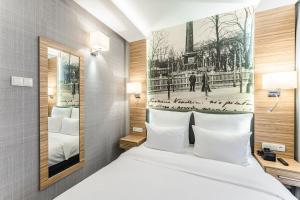 Tempat tidur dalam kamar di Hotel Wieniawski