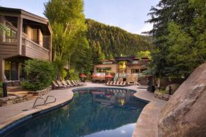 The swimming pool at or close to 3 Bedroom Mountain Residence In The Heart Of Aspen With Amenities Including Heated Pool, Hot Tubs, Game Room And Spa